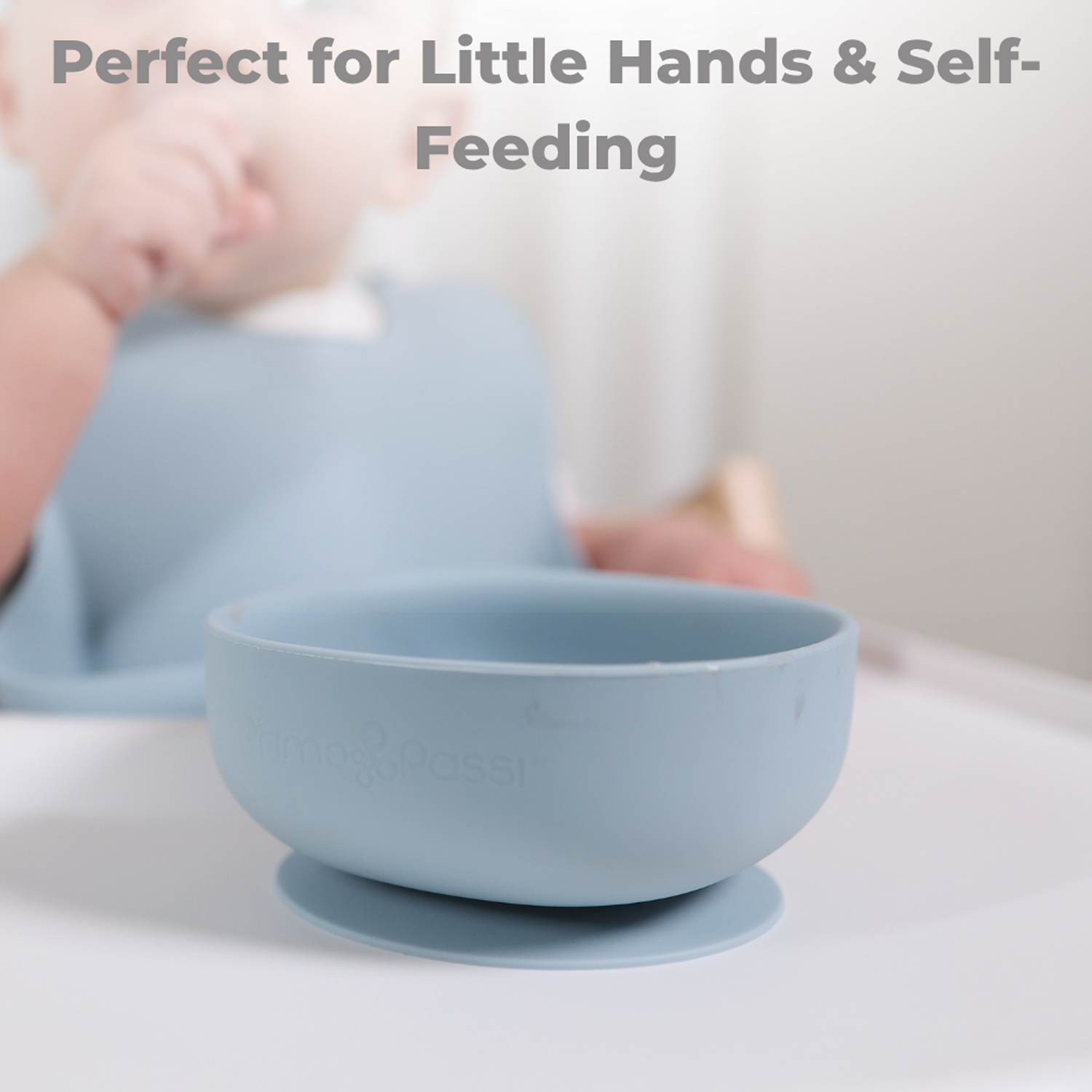 Blue suction bowl on a white surface, with text 'Perfect for Little Hands & Self-Feeding'.