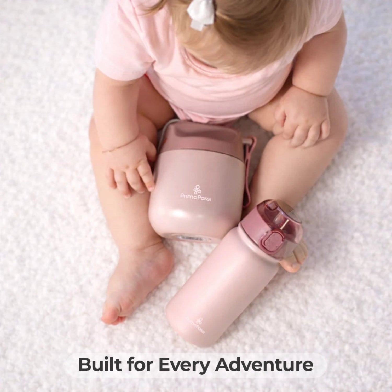 Child holding a pink insulated jar andbottle with text 'Built for Every Adventure' on a light background