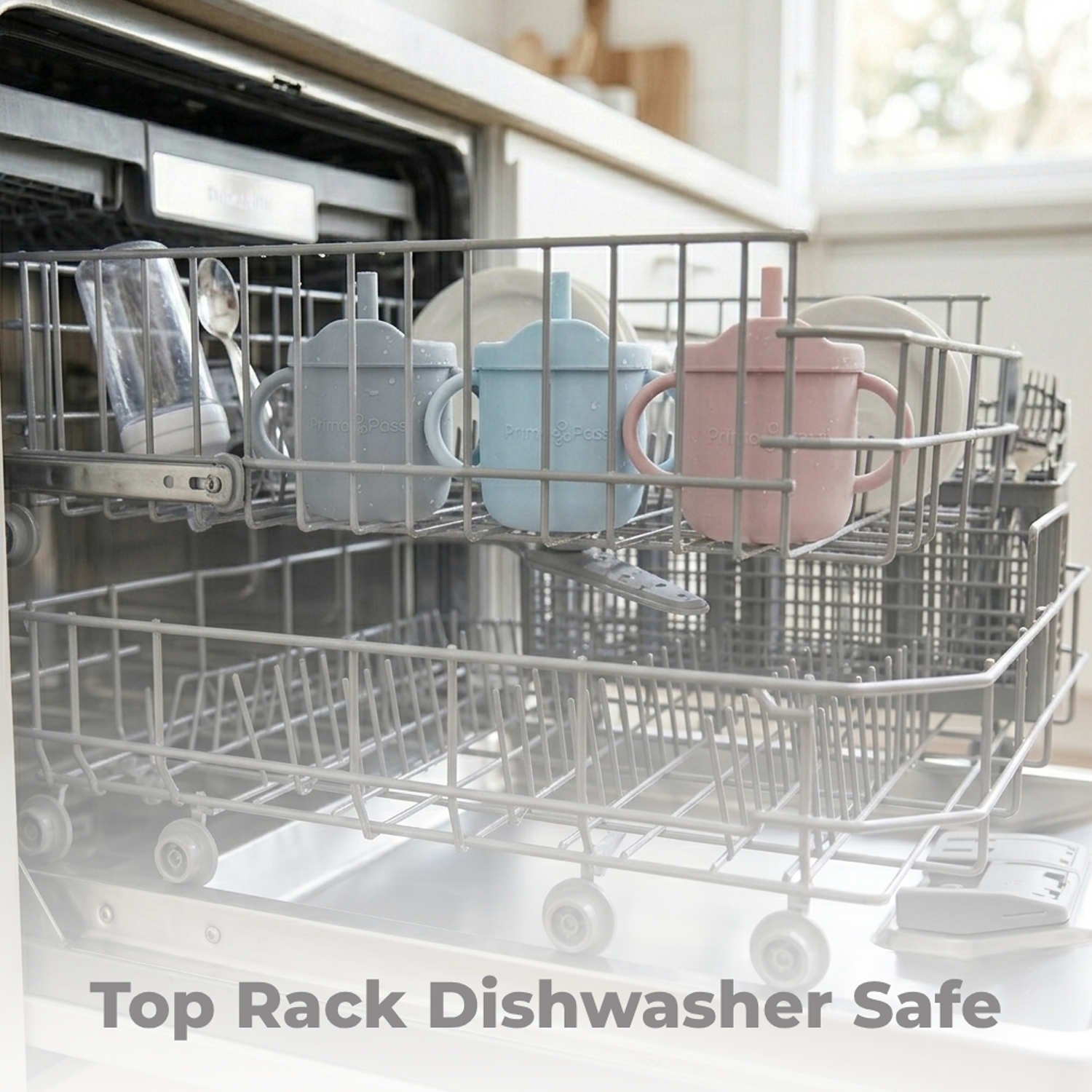 Dishwasher with a top rack containing dishes, including the silicone cups