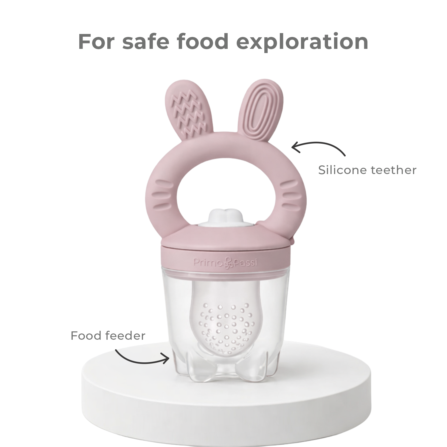 Pink silicone teether with food feeder on a white background, labeled for safe food exploration.