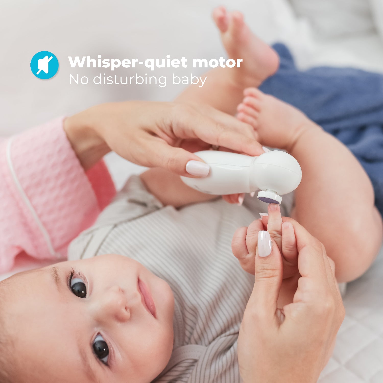 a woman using the white electric nail filer on a baby with the text: whisper-quiet motor - no disturbing baby