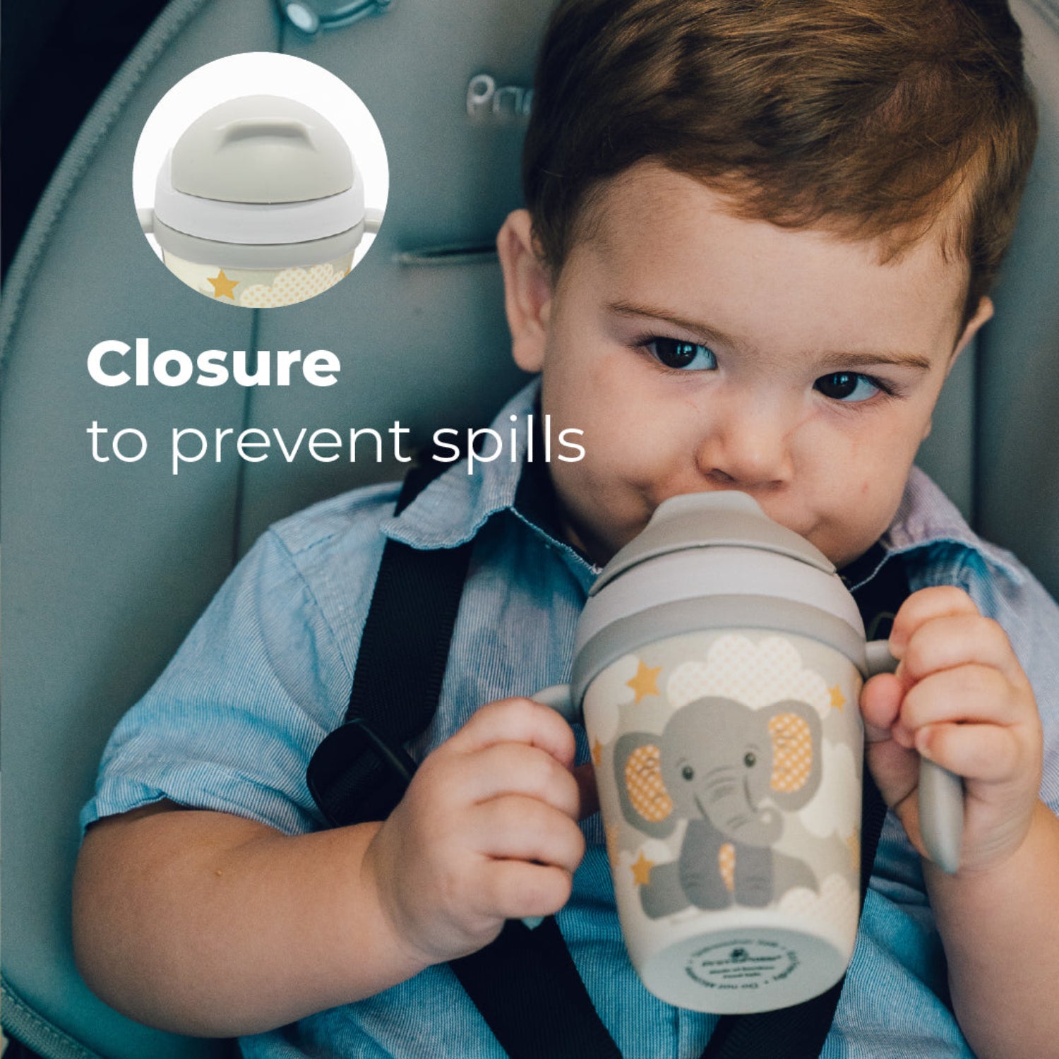 A young boy holding a Gray toddler training cup with two easy-grip handles, a soft straw, and a cute elephant illustration surrounded by clouds and stars on a light background. with a text: Closure to prevent spills