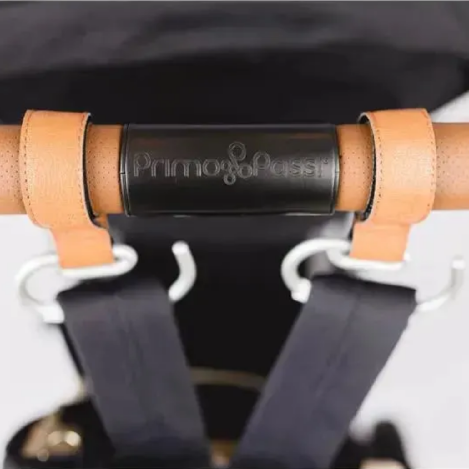 Close-up of 2 hooks in a stroller handle
