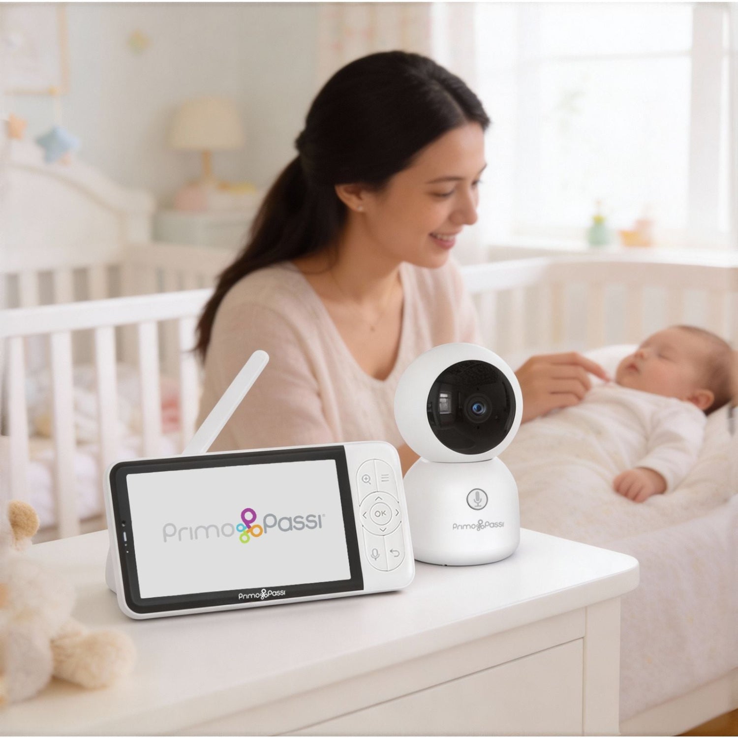 Woman with baby using a WiFi Baby Monitor in a nursery.