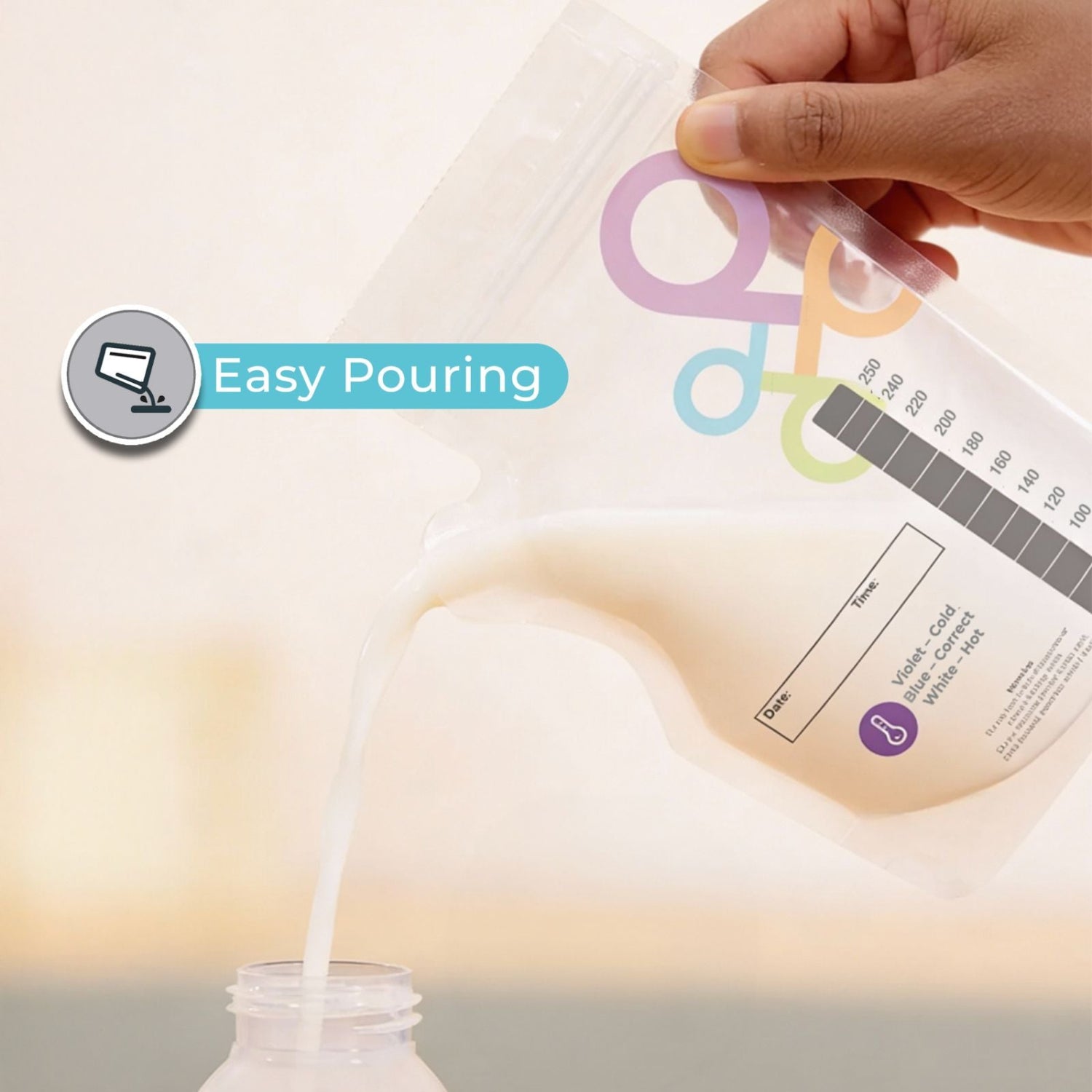 Hand pouring liquid from a breastmilk storage bag into a botlle labeled 'Easy Pouring' into a glass.