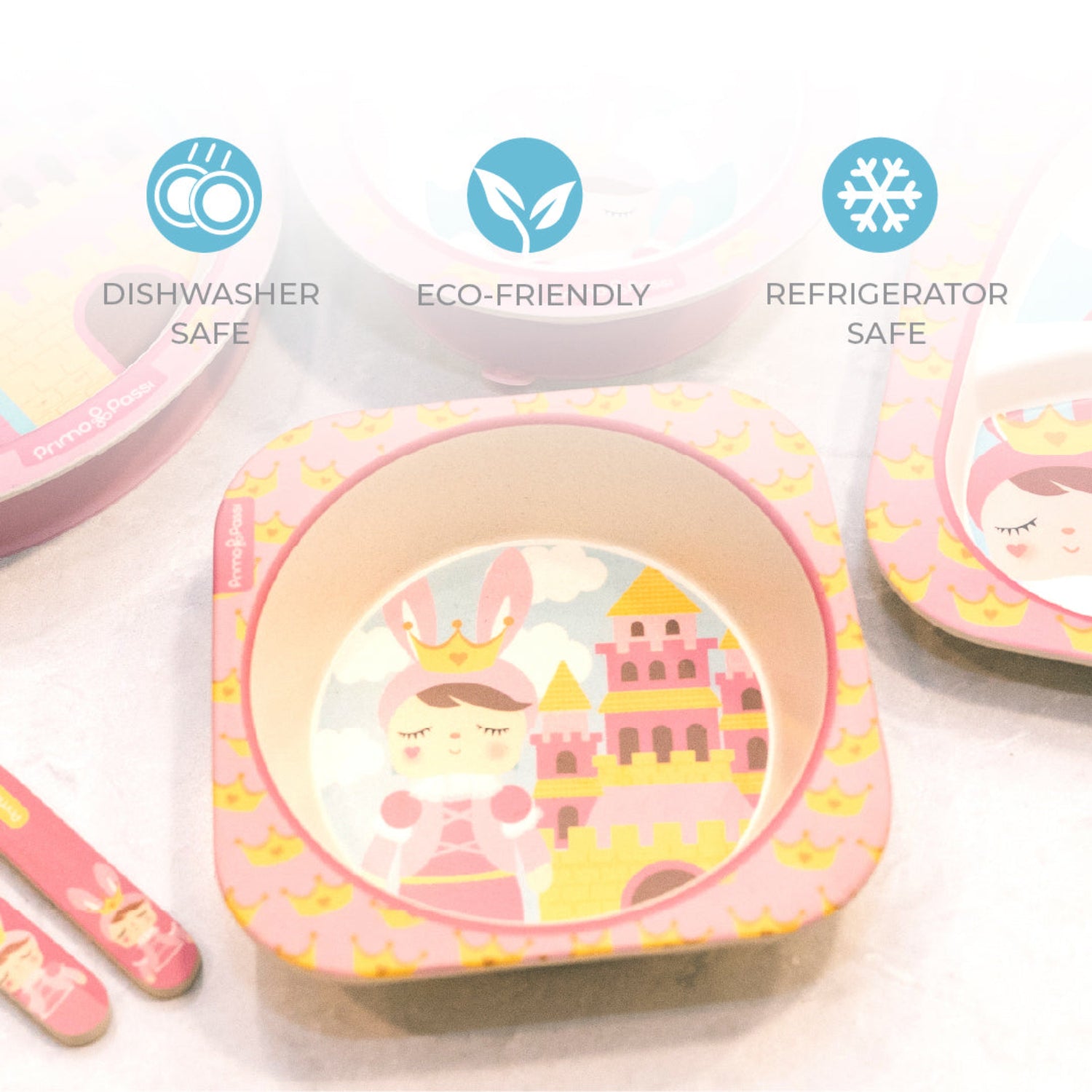 Multiple bamboo fiber children's bowls featuring a princess-themed design with a crowned character standing beside a pink and gold castle. The image highlights that the bowls are dishwasher safe, eco-friendly, and refrigerator safe for convenient everyday use.