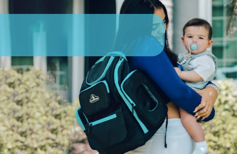 Mom Holding Baby with a Blue Backpack Diaper Bag