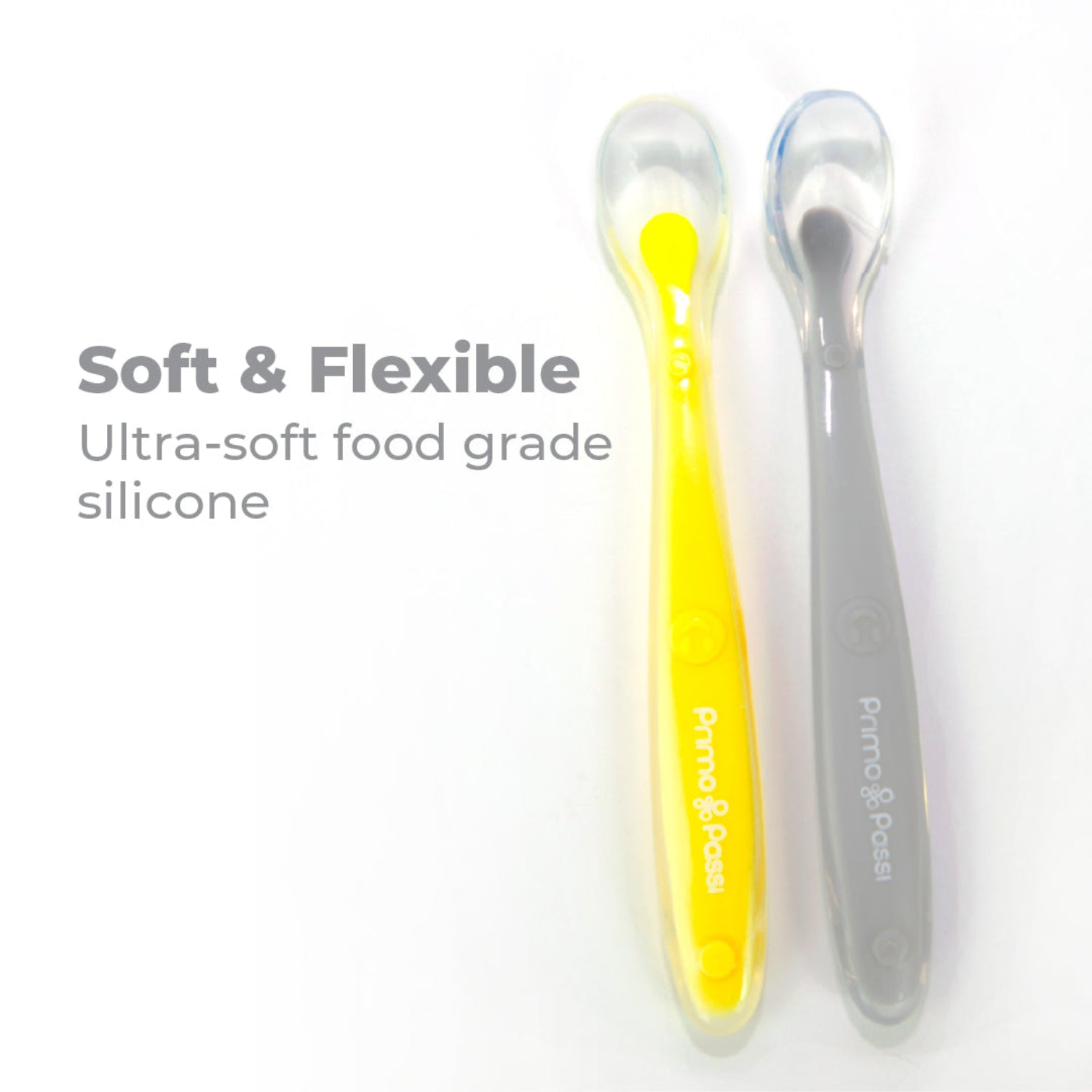 Close-up of two Primo Passi silicone baby spoons made from ultra-soft, food-grade silicone. The soft and flexible spoons are gentle on sensitive gums and designed to make first feedings and self-feeding safe and comfortable.
