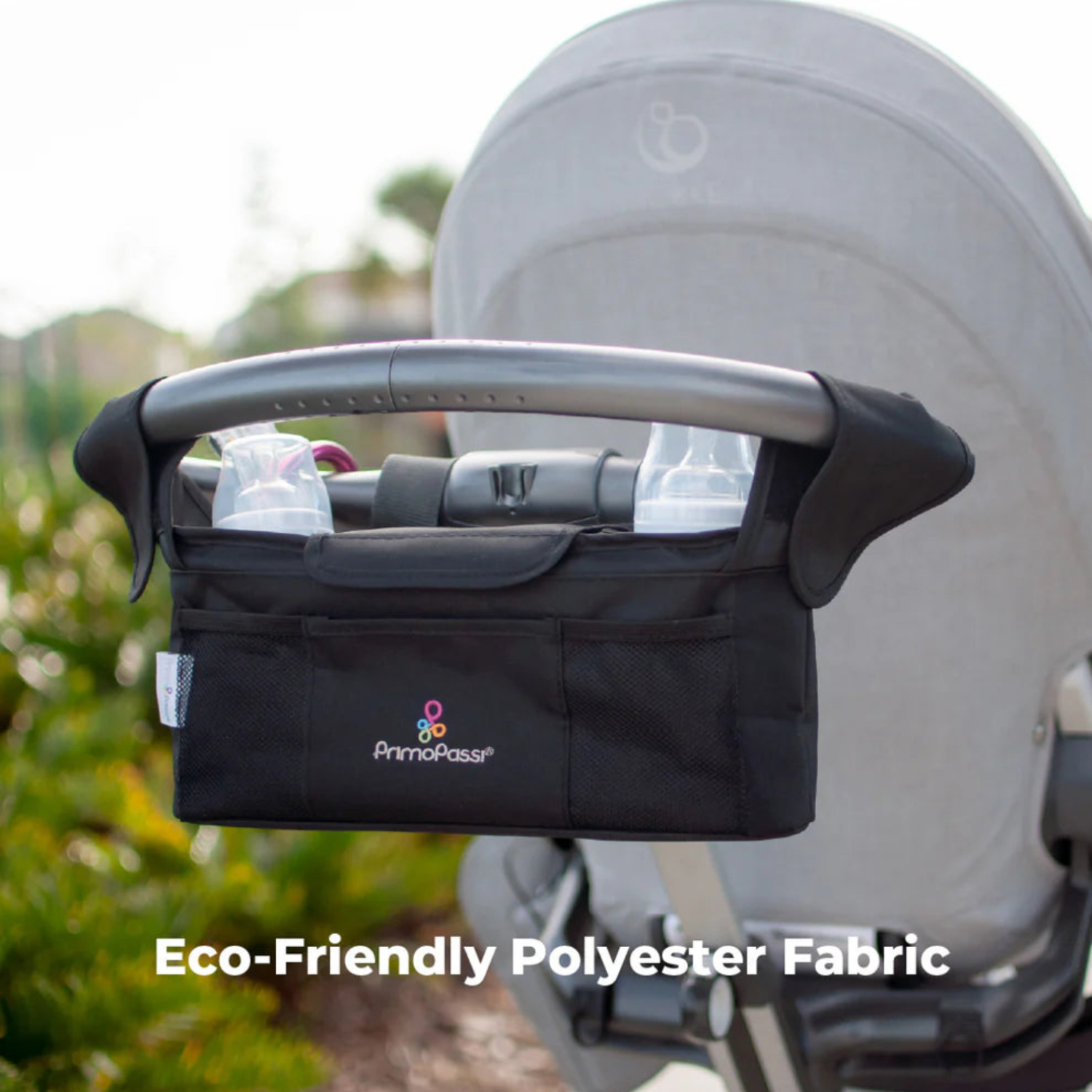 stroller organizer attached to a stroller with 'Eco-Friendly Polyester Fabric' text.
